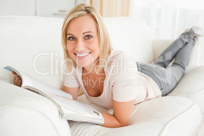Blonde woman with a magazine