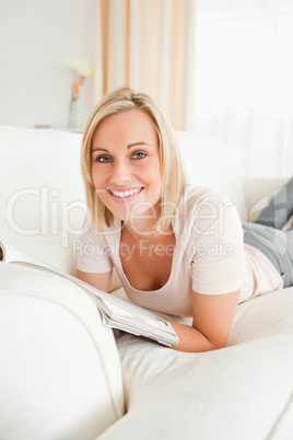 Blond-haired woman with a magazine