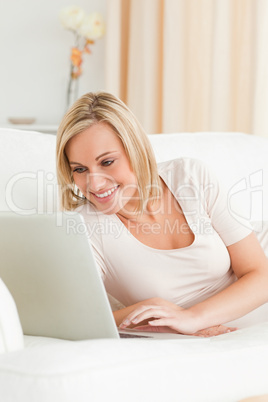 Portrait of a cute woman using a notebook