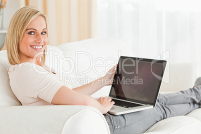 Blonde woman with a notebook