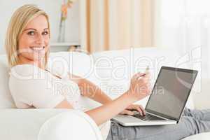 Cute woman paying her bills online