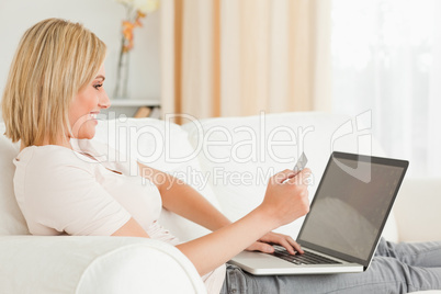 Young woman paying her bills online