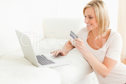 Cute woman booking her holidays online