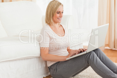 Portrait of a fair-haired woman using a laptop