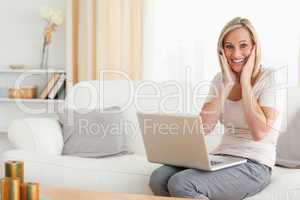 Happy woman with a laptop