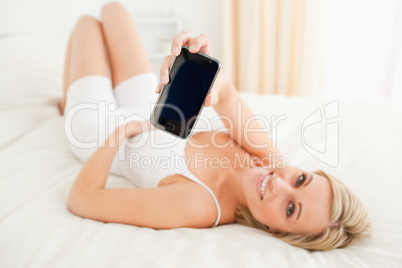 Woman showing her smartphone