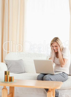 Portrait of an angry woman with a laptop