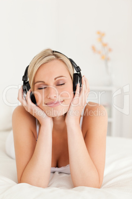 Portrait of a delighted woman wearing headphones