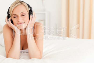 Delighted woman wearing headphones