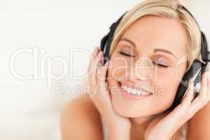 Close up of a serene woman wearing headphones