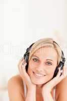Portrait of a blonde woman wearing headphones