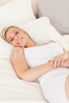 Woman lying on her bed