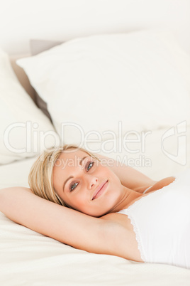 Portrait of a cute woman lying down