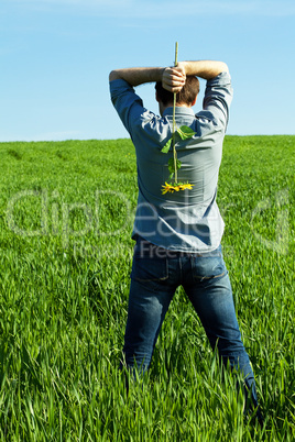 a young man and a sunflower field