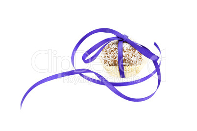 cake topped with coconut bandaged tape isolated on white