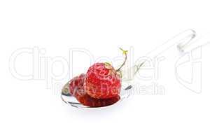 strawberry in a spoon isolated on white
