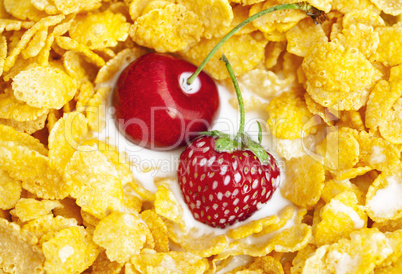 background of  bowl of cornflakes milk  cherry  and strawberry