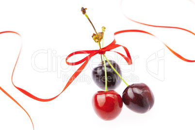 cherry with ribbon isolated on white