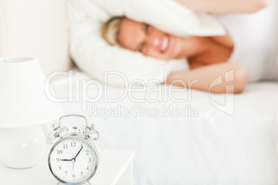 Angry blonde woman waking up Angry blonde woman waking up