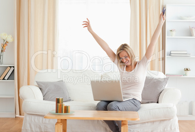 Cheerful woman shopping online