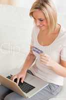 Close up of a charming woman buying online