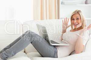 Amazed woman using her laptop