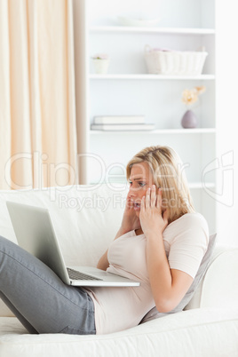 Portrait of an amazed woman having trouble her laptop