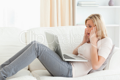 Blonde woman having trouble her laptop