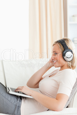 Portrait of a woman watching a movie with her laptop