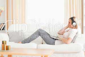 Smling woman watching a movie with her laptop