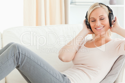 Serene woman listening to music