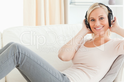 Delighted woman enjoying some music