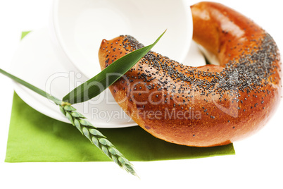 loaf with poppy seeds cup  and the spike isolated on white
