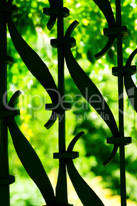 forged grating against the background of green