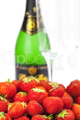 Champagne glass and strawberries isolated on white