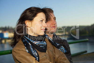 young couple on the Charles Bridge on the skyline