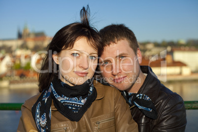 young couple on the Charles Bridge on the skyline