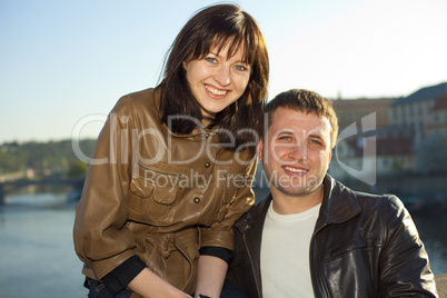 young couple on the Charles Bridge on the skyline