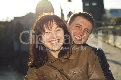 young couple on the Charles Bridge on the skyline