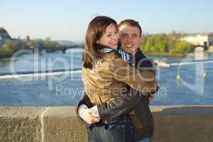 young couple on the Charles Bridge on the skyline