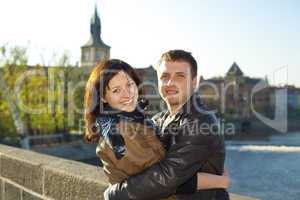 young couple on the Charles Bridge on the skyline