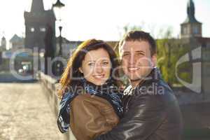 young couple on the Charles Bridge on the skyline