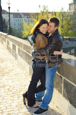 young couple on the Charles Bridge on the skyline