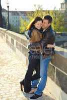 young couple on the Charles Bridge on the skyline