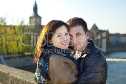 young couple on the Charles Bridge on the skyline