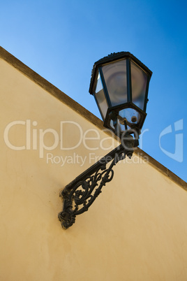 The lantern on the wall against the sky