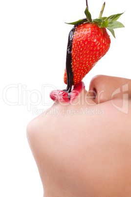 girl eating strawberry with chocolate sauc