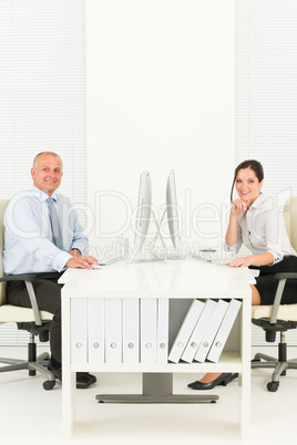 Professional businesspeople sitting in office Professional businesspeople sitting in office