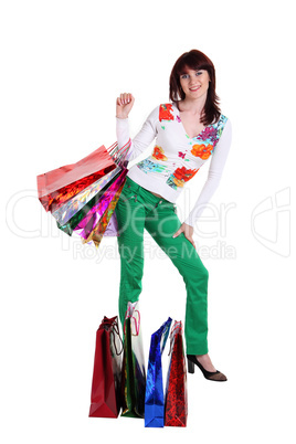 Female hand holding colorful shopping bags