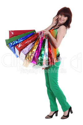 Female hand holding colorful shopping bags